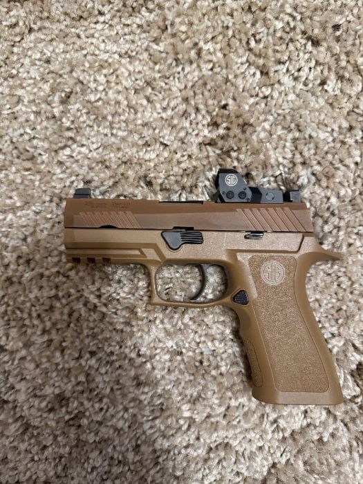 Sig P320 with concealed carry holster. 